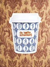 Delft tile cup against a brown damask wallcovering