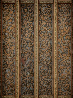 Two ceiling panels painted with brown arabesques on a blue ground