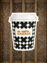 Checkerboard cup against the sacristy's carved and gilded oak panelling