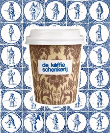 Damask-patterned cup against a wall of Delft blue figure tiles