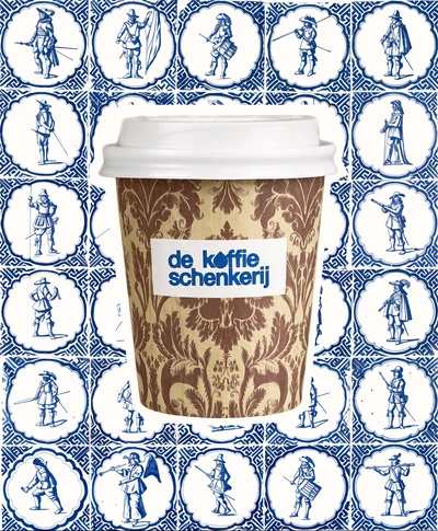 Damask-patterned cup against a wall of Delft blue figure tiles