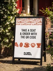 A sandwich board on the street outside the church