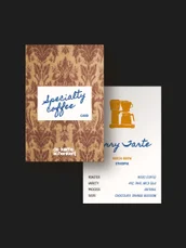 Specialty coffee packaging and cards on a dark ground