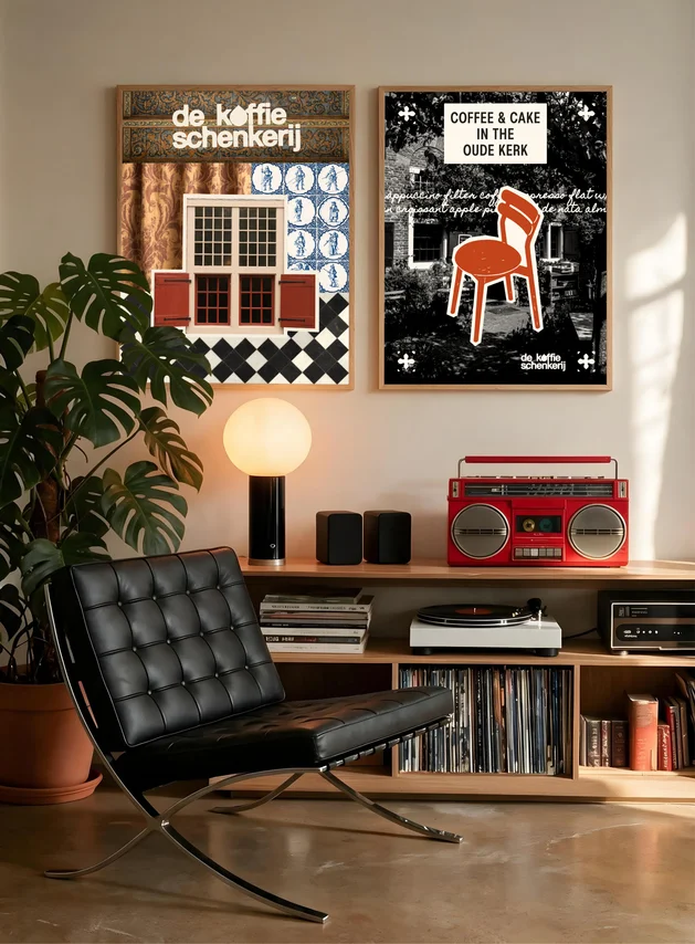 The posters hung in a living room with a leather chair